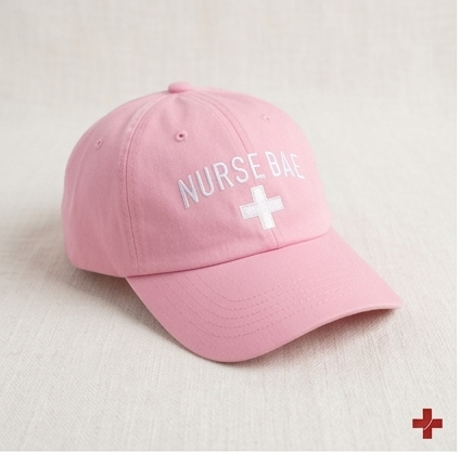 “Pink Nurse Bae embroidered dad hat worn by woman, stylish nurse cap with soft color and adjustable fit”